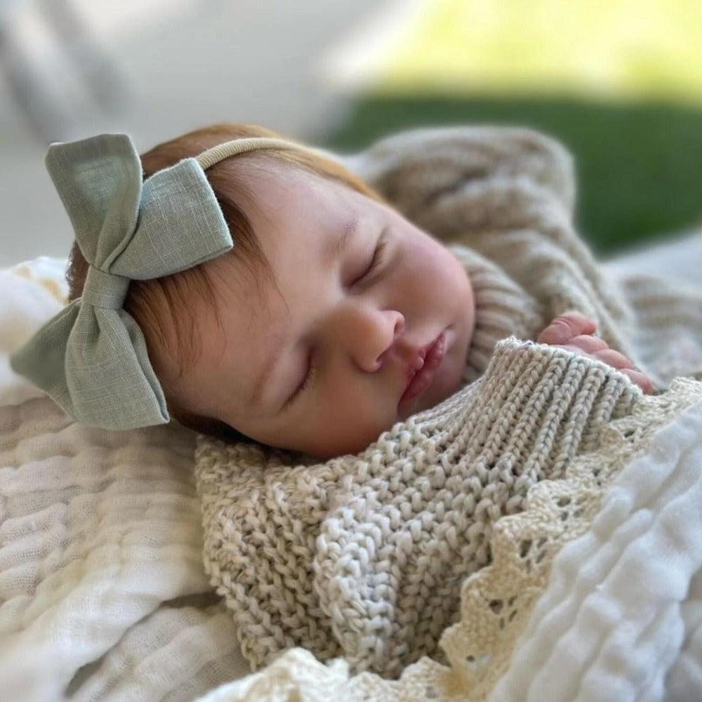 20-Inch Sleeping Reborn Baby Doll with Cloth Body and Hand-Rooted Hair