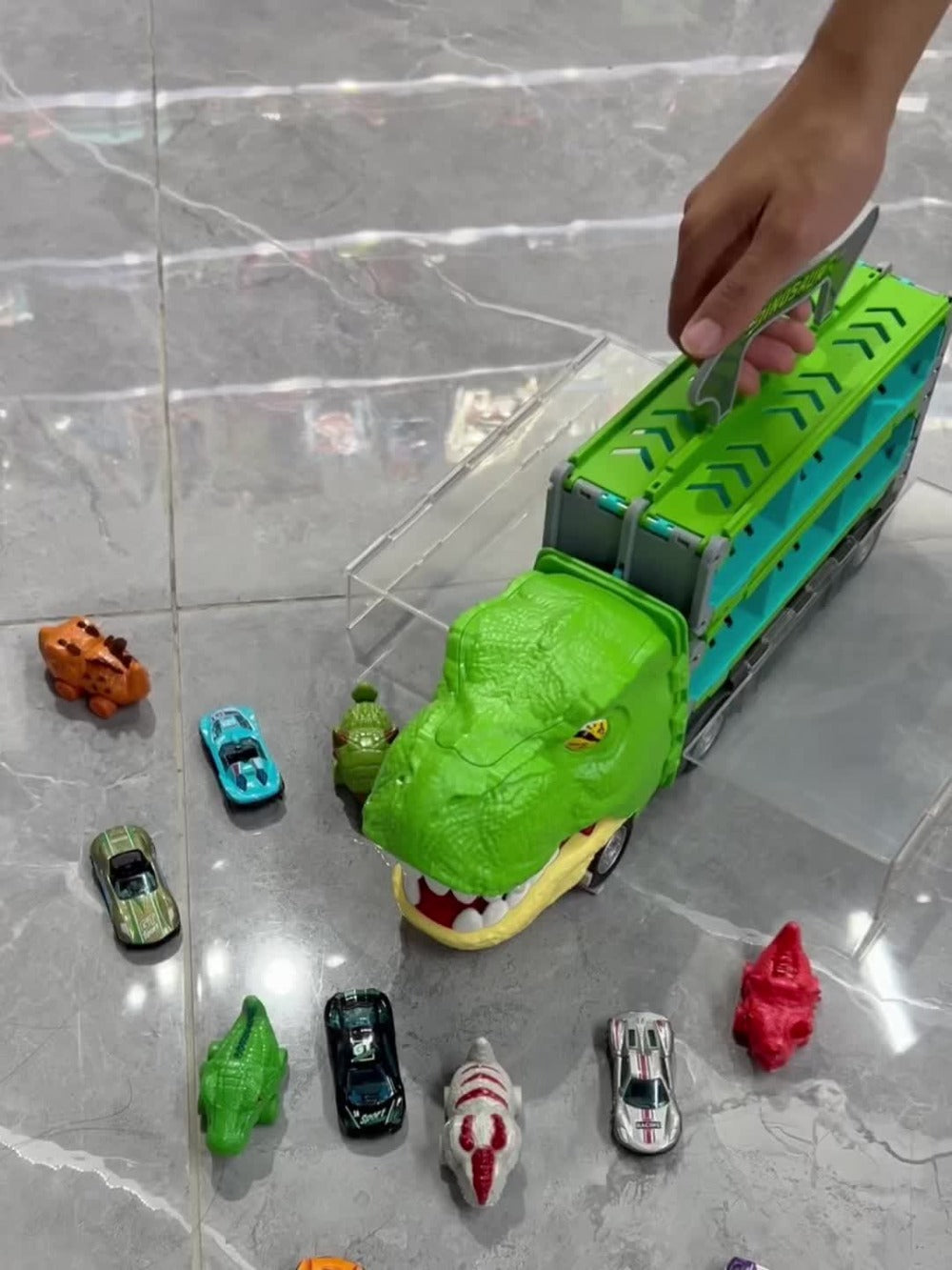 Dinosaur Truck Toy Carrier with 63-Inch Foldable Race Track, 13-in-1 Set with 12 Cars & 2-Player Racing